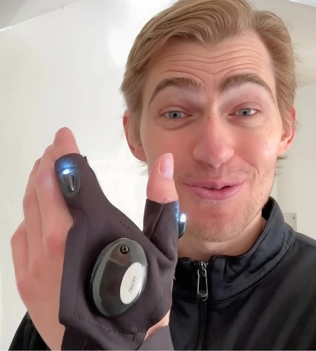 Customer showing SuperGloves LED finger lights up close