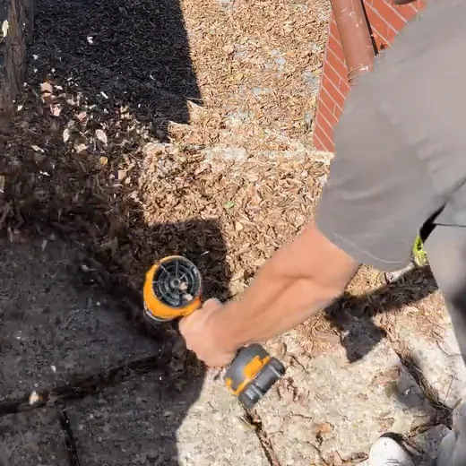 SuperLeafBlower blowing dry leaves off concrete front steps