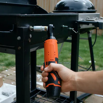 The SuperRatchet with a socket on a bolt of a barbecue cart being put together on a patio