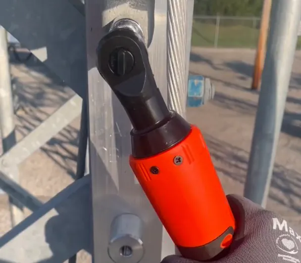 Gary R.'s own photo: his SuperRatchet on a bolt of a steel frame, held in a work glove