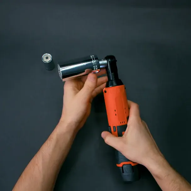 Top-down view of hands pushing a deep socket onto the SuperRatchet's square drive